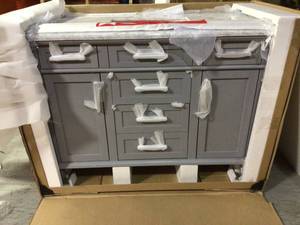 lot 22 image: Sonoma 48 in. W x 22 in. D Vanity in Pebble Grey with Marble Vanity Top in Carrara with White Basin by Home Decorators Collection (review all pictures)