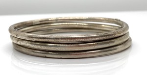 lot 230 image: Three Vintage Bezgin 900 Sterling Silver Bangles