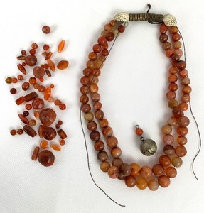 lot 240 image: Vintage African Tribal Trade Bead Necklace of Shells, Carnelian Agate and Glass Beads, and Copper Spirals, (Partially Unstrung)