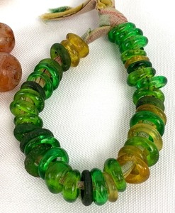 lot 241 image: Antique Carnelian Agate and Glass Beads And A Strand Of Green Recycled Glass Rondelle Beads (Ghana)- African Trade Beads