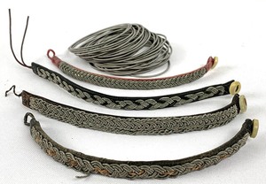 lot 244 image: Four Antique Leather and Pewter Lapland Saami Bracelets And A Supply of Tin Pewter Thread