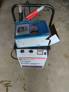 lot 130 image: Battery charger and air compressor