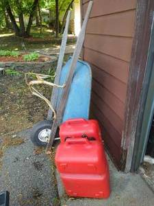 lot 534 image: Wheelbarrow & Gas Cans