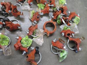 lot 81 image: BUCKET OF CAST IRON WATER LINE TAPS PLUS