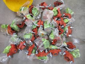 lot 83 image: BUCKET OF  CAST IRON WATER LINE TAPS