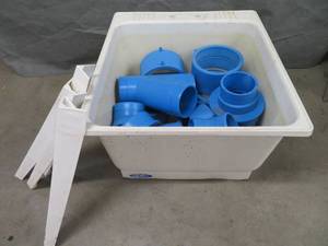 lot 90 image: PLASTIC UTILITY TUB FULL OF BLUE PVC PIPE FITTINGS