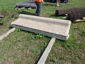 lot 18 image: Section of Concrete Curb - Makes a great bench by the fire