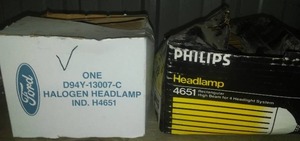 lot 43 image: Ford and Philips Headlamps and Bulb