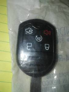 lot 130 image: New Uncut 5 Button 164-R8000 Remote Replacement Key Explorer, Flex, Taurus, MKX