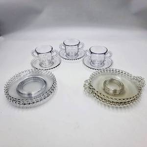 lot 07 image: Candlewick Clear Glassware (4) 8 2 Handled Plates - (4) 7 Salad Plates - (3) Double Handle Tea Cup  Saucer - CRV $140