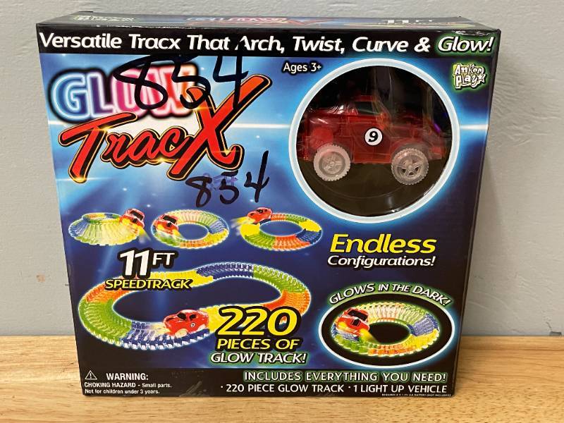lot 65 image: Glow Tracx 220 Piece Glow in the Dark Racetrack Set. 