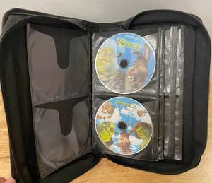 lot 39 image: Shrek 1 and 2 DVDs and DVDCD Storage Case