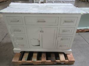 lot 101 image: Home Decorators Collection Windlowe 49 in. W x 22 in. D x 35 in. H Bath Vanity in White with Carrera Marble Vanity Top in White with White Basin - Scratch and Dent.
