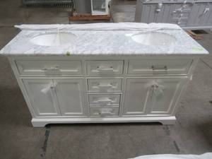 lot 103 image: Home Decorators Collection Windlowe 61 in. W x 22 in. D x 35 in. H Bath Vanity in White with Carrera Marble Vanity Top in White with White Basin. Scratch and Dent. - Cracked Top and Back Board LH Side Damage.