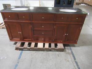 lot 115 image: Hampton Harbor 72 in. W x 22 in. D Double Bath Vanity in Sequoia with Granite Vanity Top in Black - Missing 1 Bun Foot and Has Crack in Vanity Top.