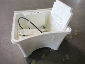 lot 313 image: Glacier Bay All-in-One 24 in. x 24 in. 20 Gal. Heavy Duty Polypropylene Freestanding Laundry Tub with Pull-Out Faucet, LT2007WWHD - Used Missing Hardware.