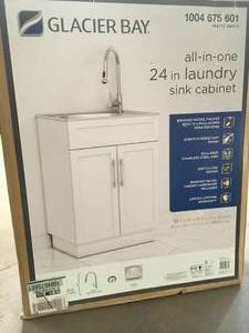 lot 31 image: All-in-One 24.125 in. x 21.375 in. x 35 in. Stainless Steel Laundry Sink with Faucet and Storage Cabinet by Glacier Bay Customer Returns See Pictures