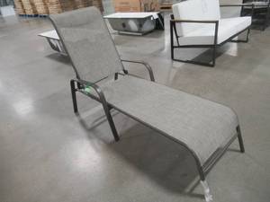 lot 148 image: Hampton Bay Steel Stackable Sling Outdoor Chaise Lounge in Riverbed Taupe with Headrest.