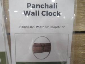 lot 648 image: Signature Design by Ashley Panchali Wall Clock A8010198