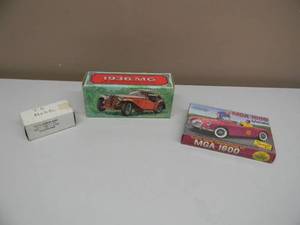 lot 23 image: NICE Vintage Set of 3 MG collectibles. 1936 MG Tai Winds After Shave 5 Fluid OZ. ACE English MG Kit NO. 8R. TD Model.