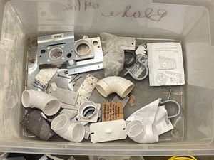 lot 18-C image: Tote Of Assorted New NuTone Central Vac Plumbing, Hardware, Accessories, Etc