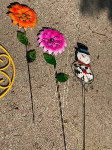 lot 114 image: Yellow Metal Plant Hanger and Three Tin Garden Deco Pieces
