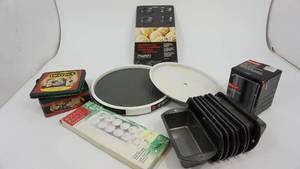 lot 74 image: Round Ravioli Maker-Nonstick Madeline Pan-Copco 12 Turntable-Crayola Trade MarkTin-11 Metal Turntable-Bodum Spare Glass-Eight Small Bread Pans