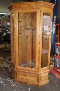 lot 40 image: Wood Corner Gun Cabinet with Rotating Holder and Drawers