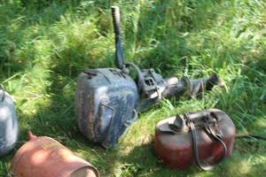 lot 884 image: Evinrude Outboard Motor  with Metal Marine Gas Tank