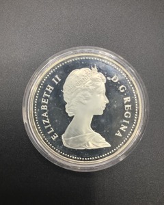 lot 6 image: 150th Anniversary Canadian Silver Dollar