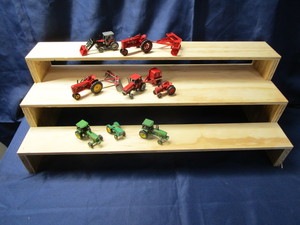 lot 97 image: Display Shelf & Tractors