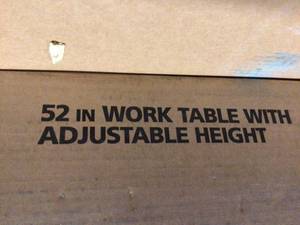 lot 11 image: 52 in. Adjustable Height Work Table by Husky  Customer Returns See Pictures