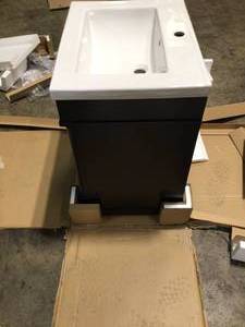 lot 22 image: 24 Vanity in. Bath Vanity in Espresso with Ceramic Top in White with White Basin by Unbranded Customer Returns See Pictures