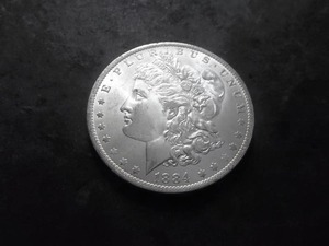 lot 25 image: 1884 O Morgan Silver Dollar