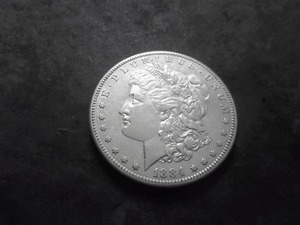lot 26 image: 1884 S Morgan Silver Dollar