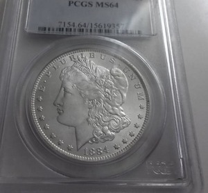 lot 27 image: 1884 O Morgan Silver Dollar