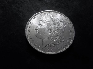 lot 28 image: 1885 O Morgan Silver Dollar