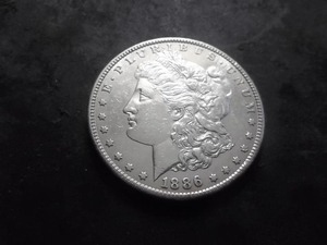 lot 33 image: 1886 S Morgan Silver Dollar