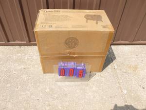Dyna-Glo Charcoal grill & smoker box. Portable design. Box unopened. As shown.