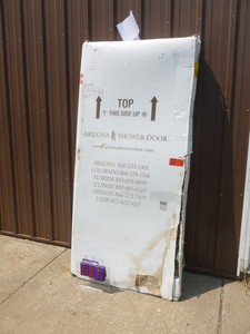 Arizona glass shower door assembly. Appears new. Completeness unknown. As shown.