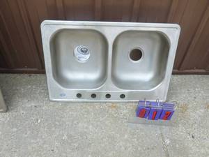 2 Compartment stainless steel sink. 20 x 34. Store display. Never installed. As shown.