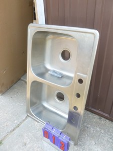 2 compartment shallow stainless steel sink. 20 x 34. Store display. Never installed. As shown.