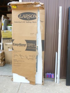 Larson 32 Storm door with hinge & jamb. New but box was damaged in shipping. As shown.