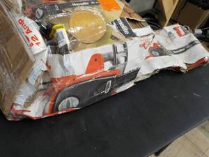 lot 281 image: Homelite 12 AMP Electric Chain Saw...