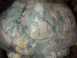 lot 430 image: Bag of 100 or so Diapers- Newborn - 3 months size and 1 Case of Healthy Timez Baby Cereal past best date