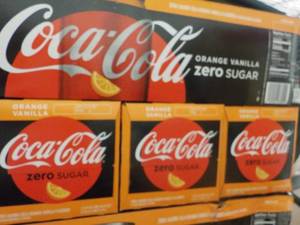 lot 467 image: 4 - 12 packs Coca Cola Vanilla Oran...