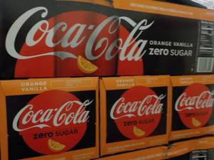 lot 470 image: 4 - 12 packs Coca Cola Vanilla Oran...