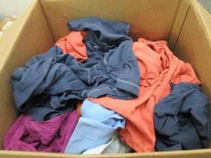 lot 179 image: Box of 50 new girls large shirts, a...