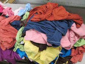 lot 180 image: Box of 65 new girls large shirts, a...