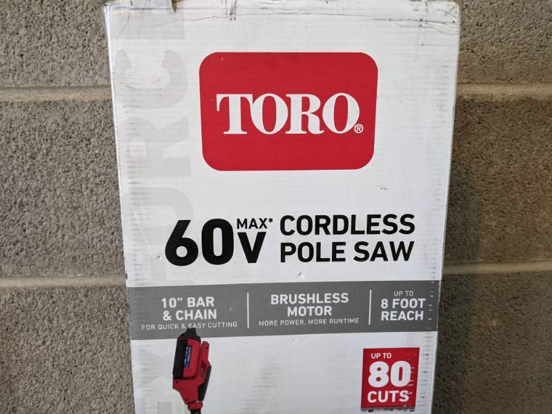 lot 18 image: Brand New Toro 10 in. 60-Volt Lithium Ion Cordless Electric Pole Saw with Battery and Charger